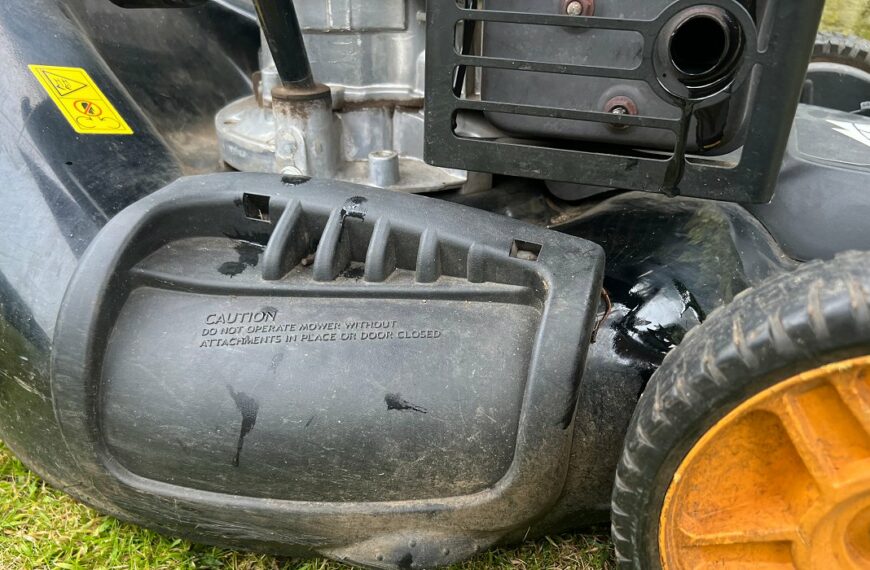 oil leaking out from lawn mower exhaust and onto deck