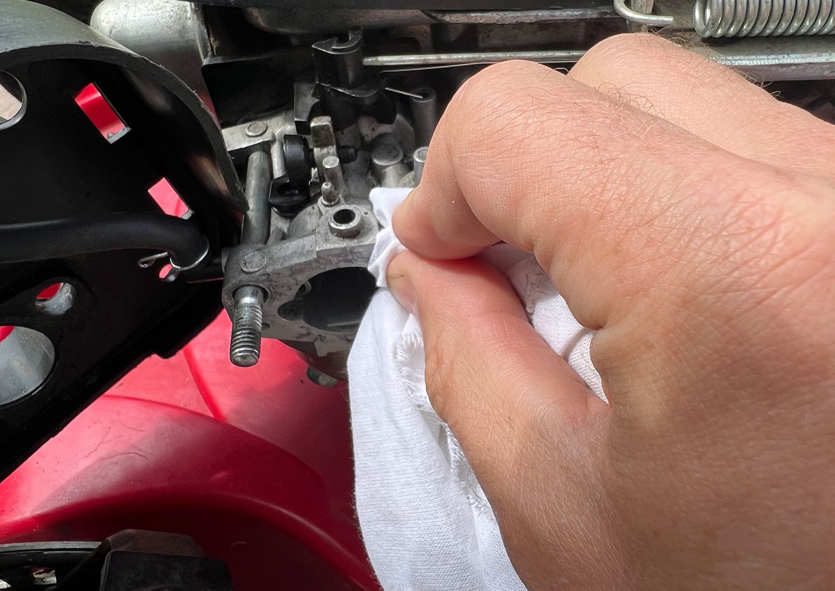 cleaning lawn mower carburetor and putting back in place