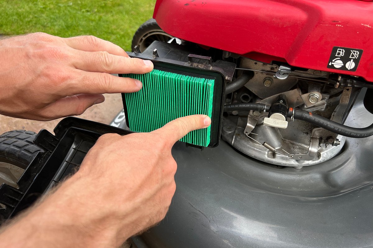 installing new air filter in gas lawn mower