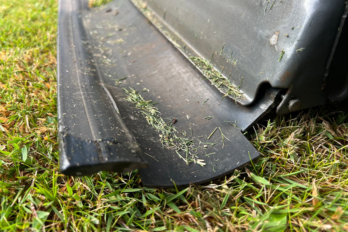 lawn mower debris shield in the right position